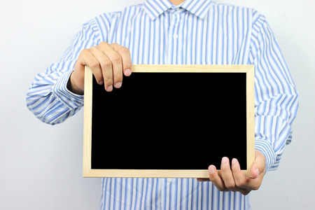 Business men are holding a blank photo frame and have copy space for design in  you work.の写真素材