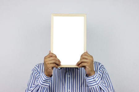 Business men are holding a blank photo frame and have copy space for design in  you work.の写真素材