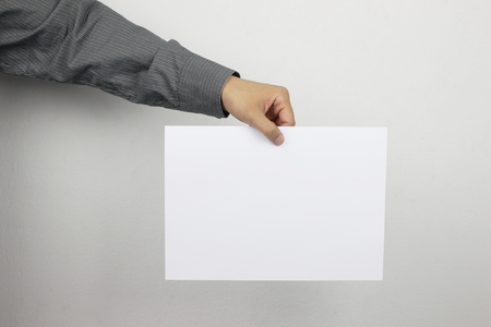 Businessmen Hold Blank white Paper and have copy space to design in your business work.の写真素材