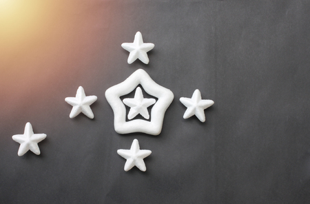 White stars are placed on a black background for business ideas and have copy space in your work.