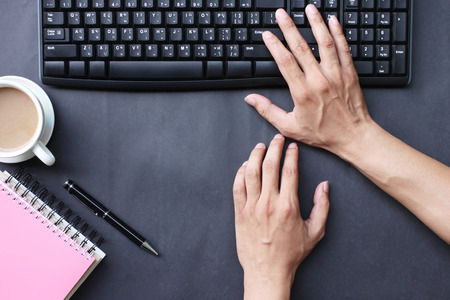 Hand of the businessman printing work business in the office on the black desk.の写真素材