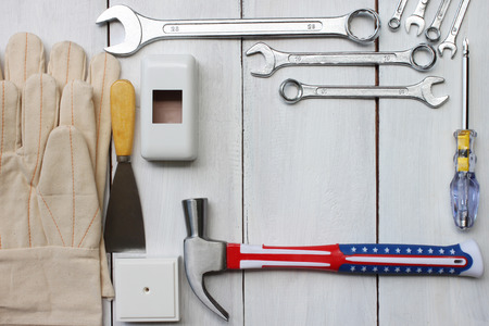 Happy labor day united states concept tool technician placed on a white wooden floor for your...
