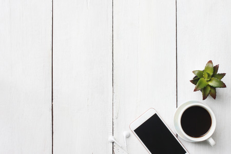 Top view business concept coffee mug and supplies on white wooden floor and have copy spaceの写真素材