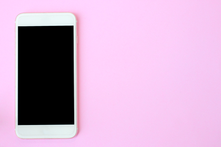 Top view smartphone on pink floor and have copy space to design for you.の写真素材