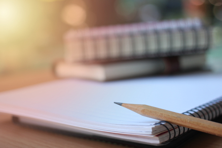 Black pen placed on the notebook and supplies.Back to school concept to use in your work.の写真素材