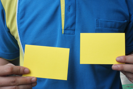 Businessman holding a blank business card to for your design.の写真素材