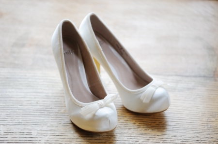 Brides white shoes with a on woodの写真素材