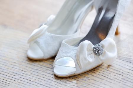 Brides white shoes closeup on wedding dayの写真素材