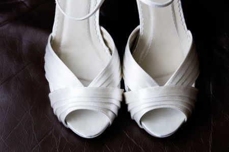 Close of brides shoes showing detail on wedding dayの写真素材