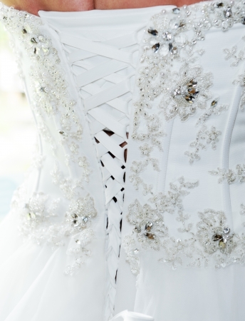 Back of brides wedding dress showing closeup detailの写真素材