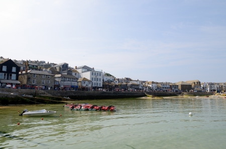 Speed boats moored in cornish harbour on a sunny summer day の写真素材