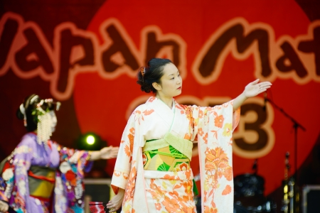London, England - October 5, 2013  Japanese geisha wearing traditional costume of kimono dancing on stage at matsuri festival のeditorial素材