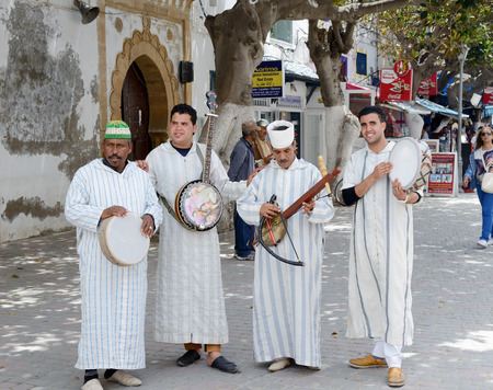ESSAOUIRA, MOROCCO - MAY 12, 2014  Musicians playing traditional instruments in the street for tourists and shoppers  Essaouira, Morocco  May 12, 2014 のeditorial素材