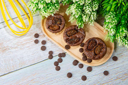 chocolate tart brownies with raisins on wooden dish - stock photo