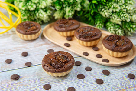 chocolate tart brownies with raisins on wooden dish - stock photoの写真素材
