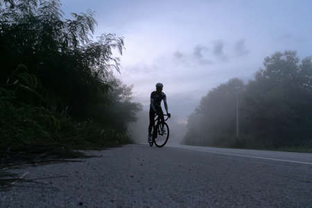 ride on bicycle in forest mistの写真素材