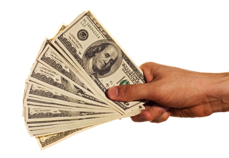 One hundred dollar bills in a hand