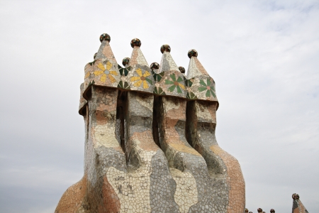 BARCELONA - MAY 08: Chimneys on the rooftop of the house Casa Batllo designed by the famous architect Gaudi on May 08, 2013 Barcelona, Spain のeditorial素材