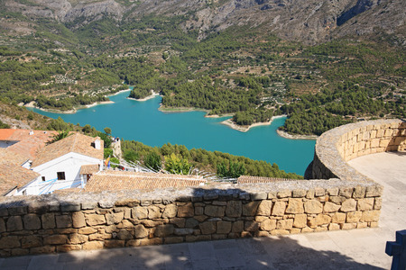Guadalest lake and village  Reservoir and tiling roofs の写真素材