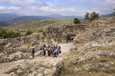 Mycenae, Greece, September, 7, 2016. Tourists walk through the Lion's Gate of Mycenae citadel. It was built more than 3000 years ago.のeditorial素材