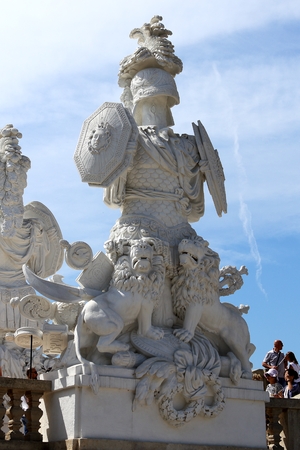Vienna, Austria, April, 30, 2018. Tourists look at statue in Royal Palace Schoenbrunn park in Vienna, Austria. Schoenbrunn was the summer residence of Austrian Emperors.のeditorial素材