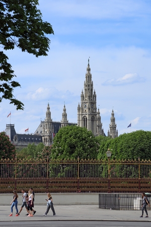 Vienna, Austria, May, 1, 2018. Tourist walk by the City Hall of Vienna. It is the main administrtion building of Austrian capital and was built several centuries ago.のeditorial素材