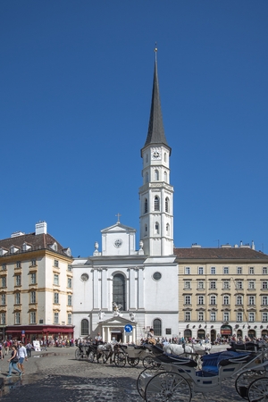 Vienna, Austria, May, 5, 2018. People look at St. Michael church in the center of Vienna. This church stands in front of the Royal Palace Hofburg.のeditorial素材