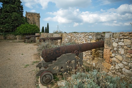 Old guns in Tarragona Passeig arqueologic (Archaeological Promenade) under Roman era wallsのeditorial素材