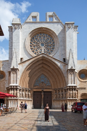 Tarragona, Spain - September, 06, 2018. People walk near facade of Tarragona cathedral. This church is the main medieval landmark of the city.のeditorial素材