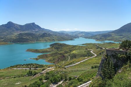 Water reservoir near Zahara de la sierra white village in Andalusia, Spainの写真素材