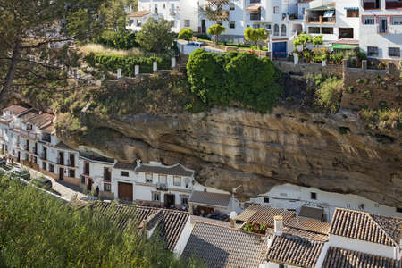 Setenil de las Bodegas, Spain - May, 10, 2019. A small town Setenil de las Bodegas in southern Spain famous for its dwellings built into rock overhangs above the R?o Guadalporc?n.のeditorial素材