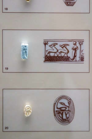 Mycenae, Greece - August, 30, 2019. Stone seals on display of Mycenaen museum. In the second millennium BC, Mycenae was one of the major centres of Greek civilization.のeditorial素材