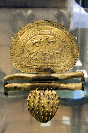 Vatican, Italy - January, 04, 2020. Ancient Etruscan golden breastplate decoration on display of the Museums of Vatican. The Museum holds one of the biggest collection of ancient art objects.のeditorial素材
