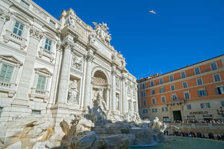 Rome, Italy - January, 6, 2020. The crowd of tourists visit the Trevi Fountain. It is the largest Baroque fountain in the city and one of the most famous fountains in the world.のeditorial素材