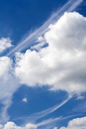 Blue sky with beautiful clouds and plane stripesの写真素材