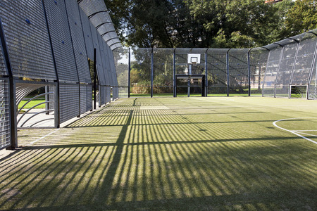 Soccer and basketball cage with artificial turfの写真素材