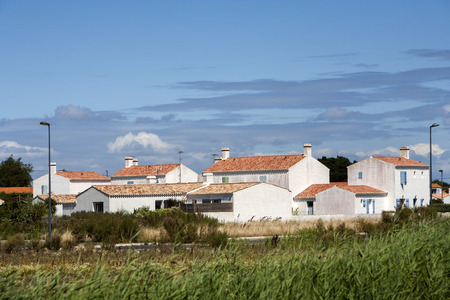 Village view on Noirmoutier island in France. Tranquil residential district with white plastered housesの写真素材