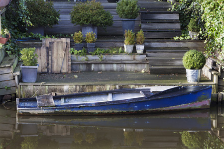 Idyllic boat near the houseの写真素材