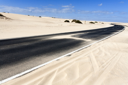 Asphalted winding highway near Oliva on Fuerteventuraの写真素材