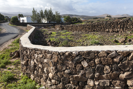 Old walls border the property on the island of Fuerteventuraの写真素材