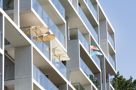Parasols on the balcony of a contemporary apartment block in Rotterdam in the Netherlands