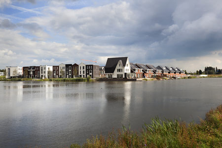 New built neighborhood near water in the Netherlandsの写真素材