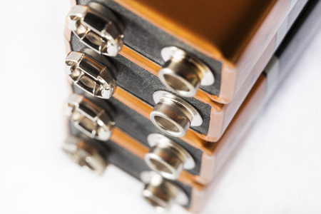 Stack of nine volt batteries  on white background