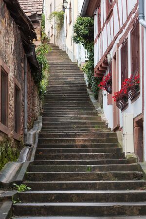 Old staircase street with idyllic houses in Niederbronn les Bains in France