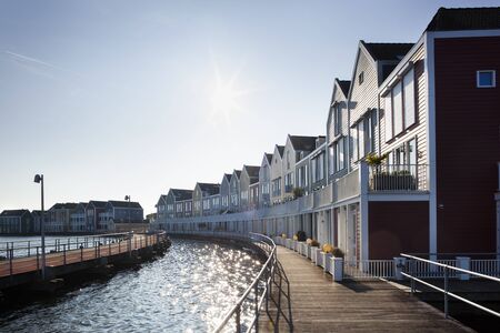 Wooden houses surrounded by water in Houten in the Netherlandsの写真素材