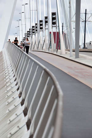 Rotterdam, Netherlands â€“ September 13, 2021: : Pedestrians on the Erasmus bridge in Rotterdam