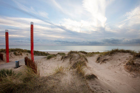 Dunes and sea with a nice sky at the coast of the Maasvlakte in the Netherlandsの写真素材