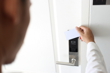 Man using keycard contactless for unlock door in hotel.の写真素材