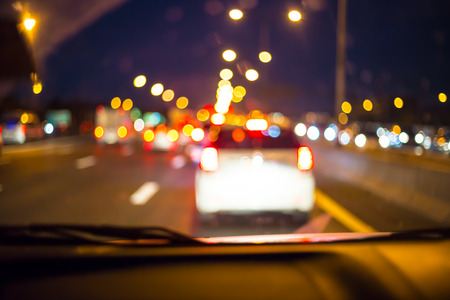 Abstract bokeh of road in car at BKK,Thailand for background.の写真素材