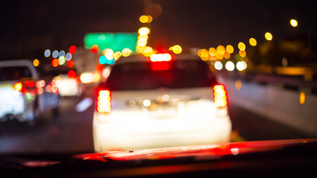 Abstract bokeh of road in car at BKK,Thailand for background.